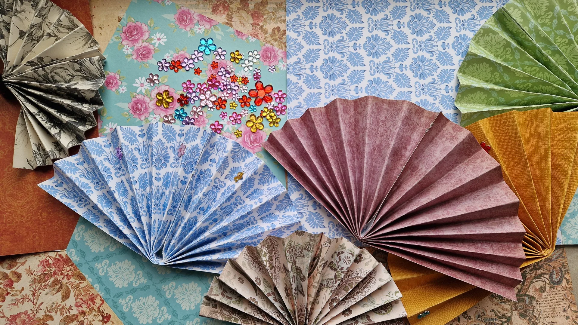 Hand fans with different colors and patterns.